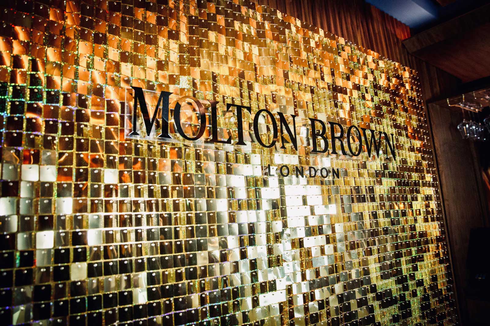 Molton Brown Branded Gold Shimmer Wall
